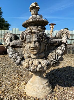 a statue of a man with a bird on top of it