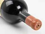 a bottle of wine with a cork stuck in it