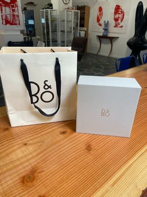 an image of a white bag sitting on top of a wooden table