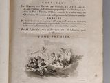 an open book with a picture of a man and a woman in a boat