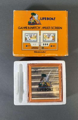 une image représentant une console de jeux Nintendo posée sur une table, accompagnée d'une boîte