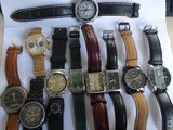 a lot of watches that are sitting on a table