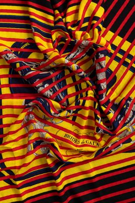 a close up of a red, yellow and black striped fabric