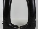 pair of black leather riding boots with buckles on each side