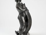 an image of a statue of a woman holding a cat