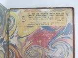 an old book with a picture of a painting on it
