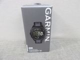 the garmin watch is in the box on the table