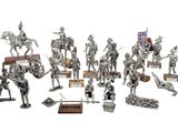 silver figurines of knights and soldiers on a white background
