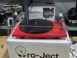 a record player sitting on top of a box in a store