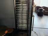 an image of a room with a refrigerator and a table