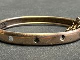 a close up of a bracelet on a table