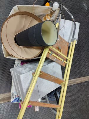 a yellow ladder that has a horn on top of it