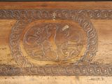 a wooden box with a carved design on it