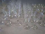 many empty wine glasses sitting on a table