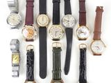 a lot of watches that are sitting together on the table