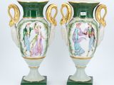 pair of green and gold vases with figures painted on them