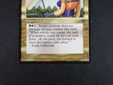 a picture of a card with a picture of a woman holding a sword