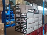 many boxes on the shelves in the warehouse