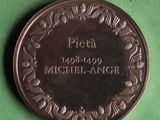a close up of a coin on a table with a green background