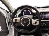 the interior of a car with a steering wheel and dashboard controls