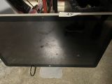 a computer monitor sitting on top of a table