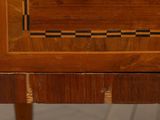 a close up of a wooden table with a clock on it