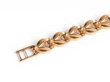 an image of a gold bracelet on a white background