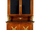an antique wooden cabinet with two doors and a marble top