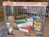 a large metal cage filled with boxes and other items