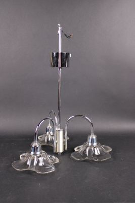 pair of silver plated candlesticks on a black table