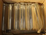 a box with a bunch of clear plastic tubes inside of it