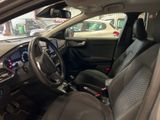 the interior of a car with a steering wheel and dashboard controls