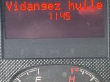 dashboard of a car with a digital display displaying the time