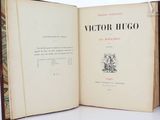 a book open on a table with a drawing on it