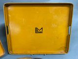 a yellow box with a black m logo on it