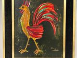 tableau représentant un coq sur fond noir, dans un cadre doré