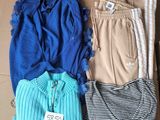 three pairs of pants and a shirt in a box