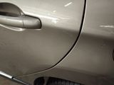 a close up of a car door handle with a sticker on it