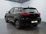 the rear end of a black car in a showroom