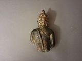 a small statue of a person sitting on a table