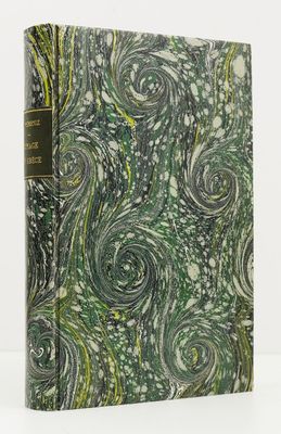 un livre vert et blanc orné d'un motif en spirale