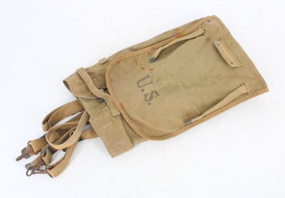 a small bag with a handle on it on a white surface