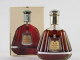 an image of a bottle of brandy sitting next to a box