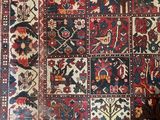 an image of a large oriental rug on a wooden floor