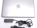 a laptop computer with a power cord attached to it