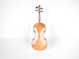 a close up of a violin on a white surface with a cross on the back