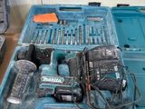 a blue tool box with tools in it on a table