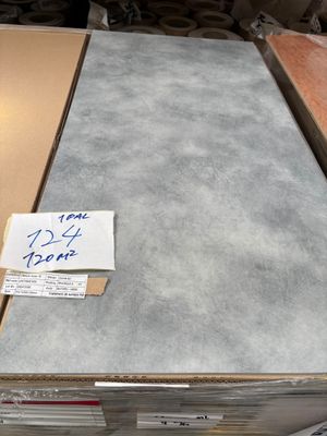 a stack of boxes with a sign on top of it