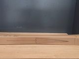 two boxes stacked on top of each other in front of a tv