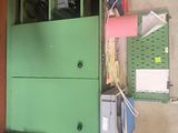 a green cabinet with a bunch of items on top of it